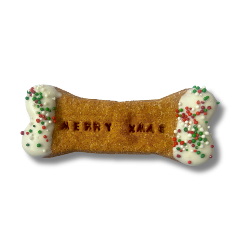All-natural handmade Christmas dog treats shaped like bones and trees.”